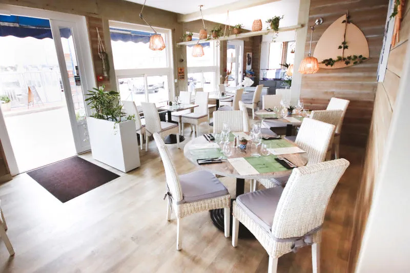 View of the interior of the restaurant with tables and chairs